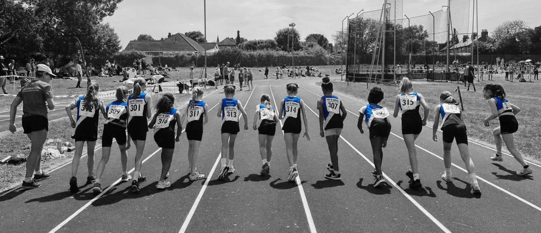 Young athletes lining up on the track at a Kingston & Poly home meeting
